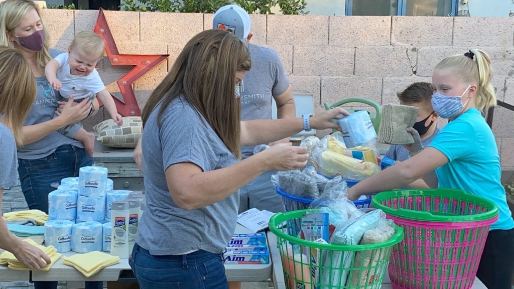 Hammersmith Support | Hammersmith Supports Our Community; Coming Together to Give Back families pack laundry baskets with personal care items