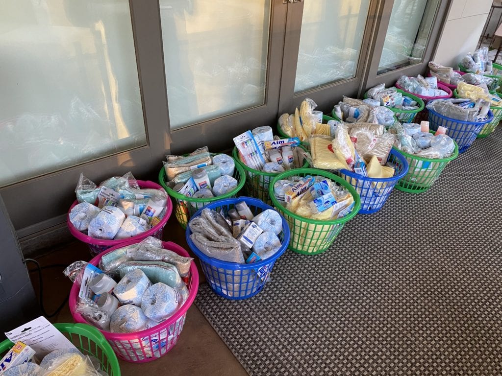 Hammersmith Support | Hammersmith Supports Our Community; Coming Together to Give Back laundry baskets full of personal care items for UMOM charity